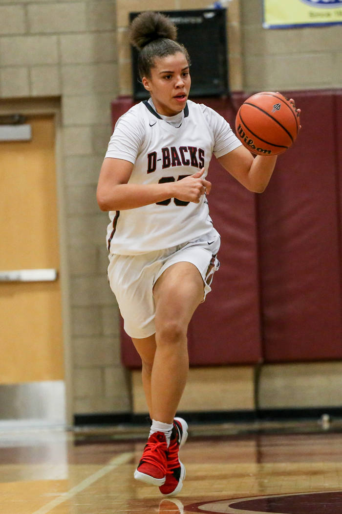 Desert Oasis’ Dajaah Lightfoot (35) dribbles the ball during the third quarter of a ba ...