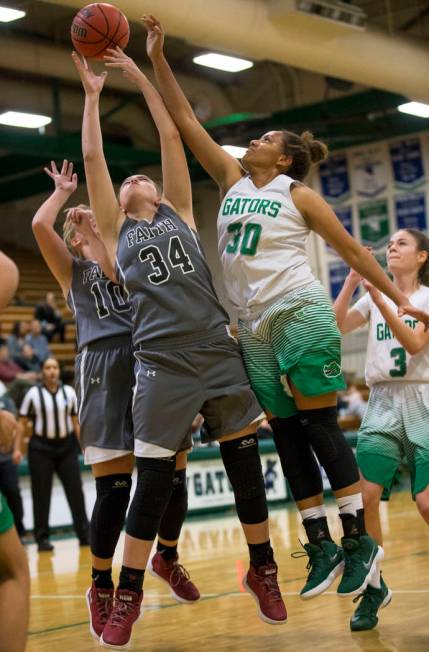 Faith Lutheran’s Ellery Wilson (10) and Kelsey Howryla (34) and Green Valley’s S ...