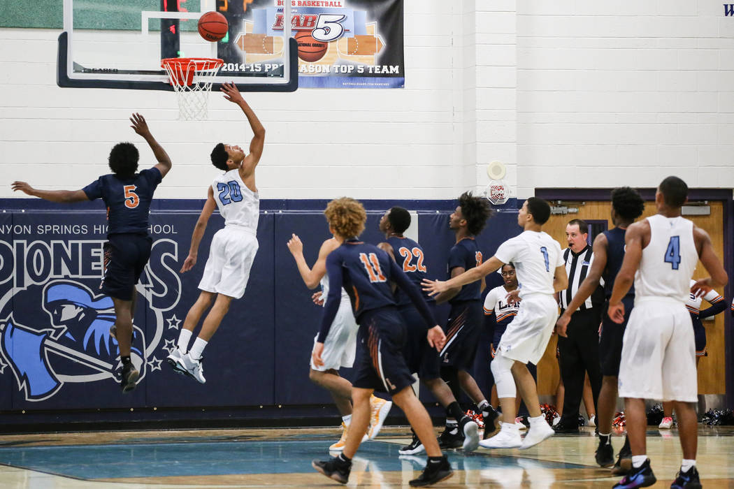 Canyon SpringsՠKaeJon Barnes (20), second from left, scores against Legacyճ Chri ...