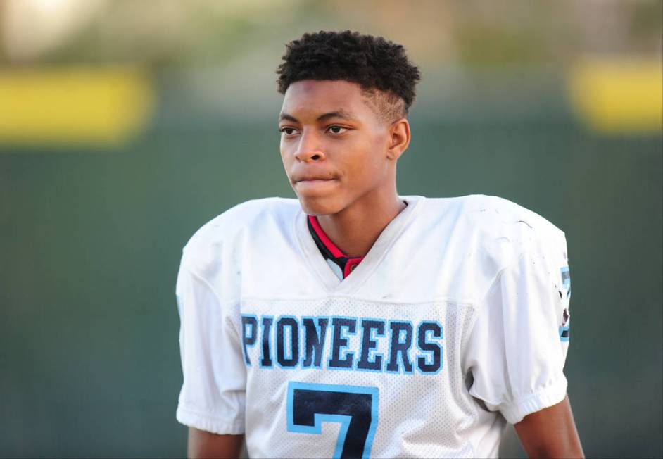 Canyon Springs quarterback Johnathan Bailey takes a break during practice at Canyon Springs ...