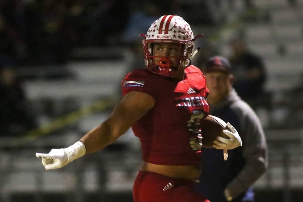 Liberty player Crishaun Lappin (9) runs the ball to the end zone for the first touchdown aga ...