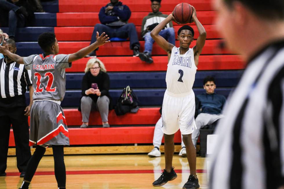 Desert Pines’ Dayshawn Wiley (2) passes the ball to a teammate during the second half ...