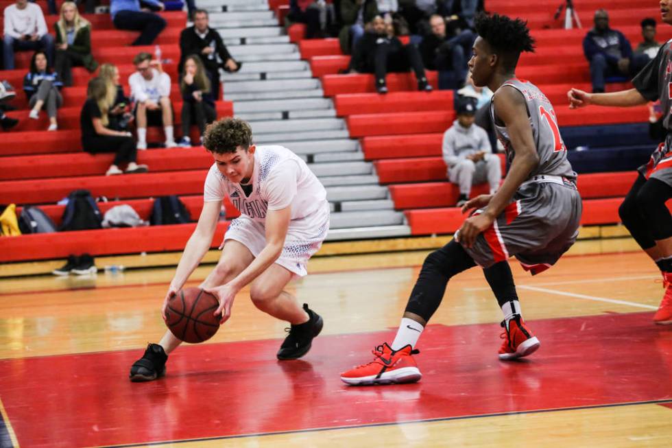 Desert Pines’ Garrett Partain (33) gains possession of a loose ball during the second ...