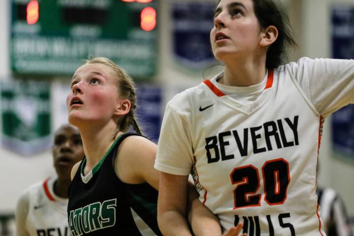 Green Valley’s Julia Clark (10) and Beverly Hills’ Isabel Rund (20) eye a reboun ...