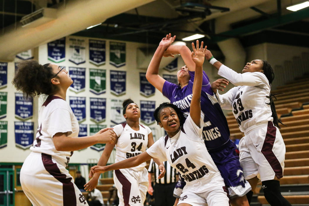 From left to right: Cimarron-Memorial’s Aaliyah Hanley (21), Cimarron-Memorial’s ...