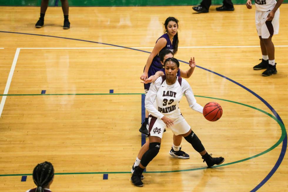 Cimarron-Memorial’s Amoura Whitney (33) passes the ball during the third quarter of a ...