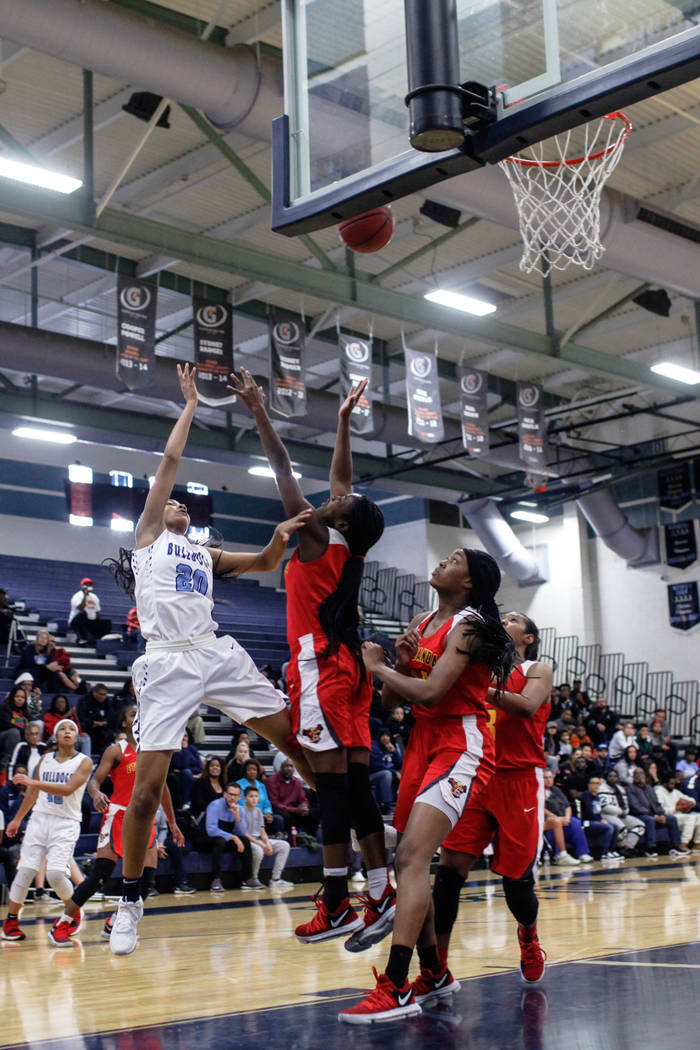 Centennial’s Taylor Bigby (20) shoots the ball against Etiwanda’s Kimora Sykes ( ...