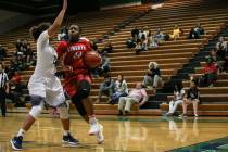 Spring Valley’s Kayla Harris (11) guards Liberty’s Dre’una Edwards (44) ...