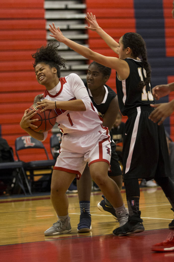 Liberty’s Jahnae Nickels (1) is pressured against Bonita Vista in the girl’s bas ...