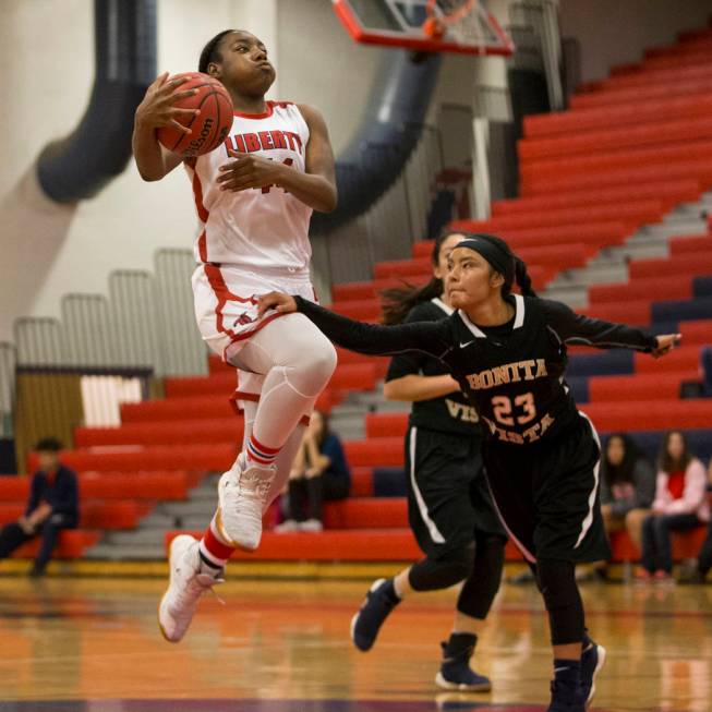 Liberty’s Dre’una Edwards (44) leaps before passing the ball against Bonita Vist ...