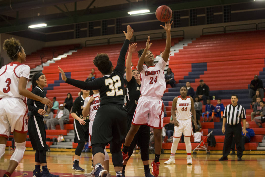 Liberty’s Trinity Vasquez (24) goes up for a shot against Bonita Vista in the girl&#82 ...