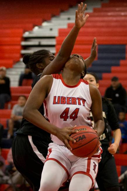 Liberty’s Dre’una Edwards (44) is pressured under the basket against Bonita Vist ...