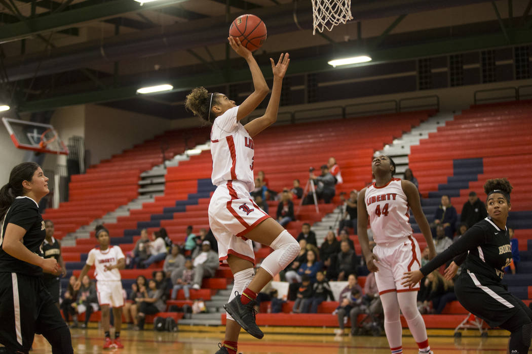 Liberty’s Journie Augmon (3) goes up for a shot against Bonita Vista in the girl&#8217 ...