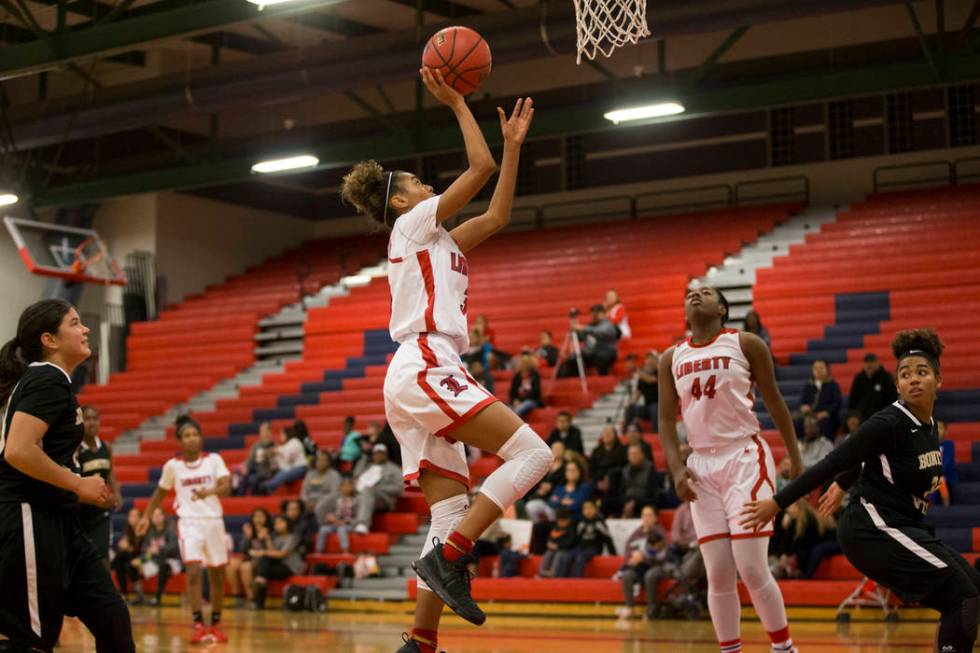 Liberty’s Journie Augmon (3) goes up for a shot against Bonita Vista in the girl&#8217 ...