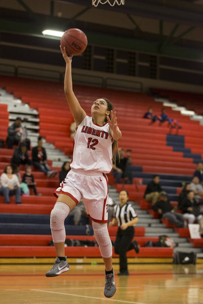 Liberty’s Leilani Padilla (12) goes up for a shot against Bonita Vista in the girl&#82 ...