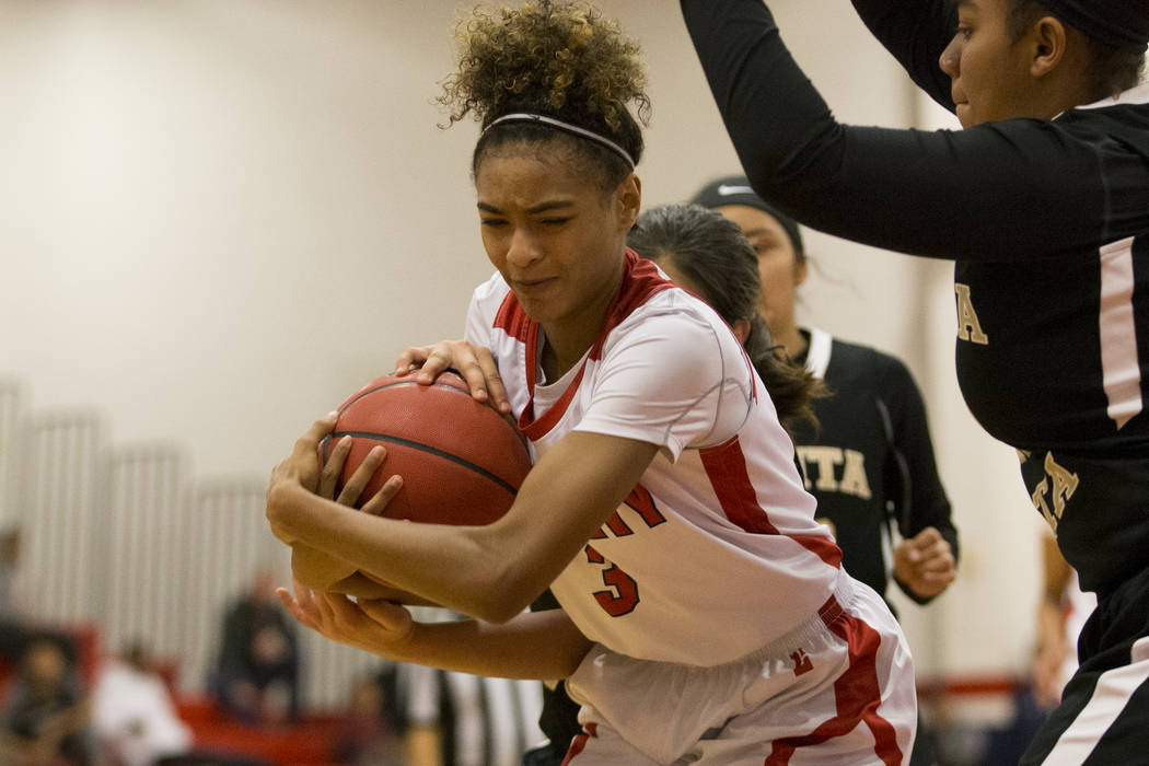 Liberty’s Journie Augmon (3) is pressured after an offensive rebound against Bonita Vi ...