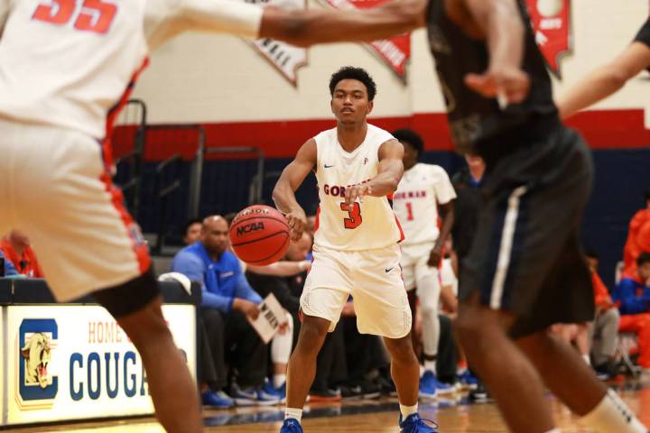 Bishop Gorman’s DJ Howe passes the ball in the boys basketball game against Sierra Can ...