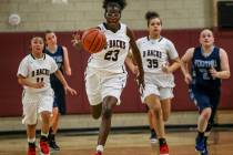 Desert Oasis’ Desi-rae Young (23) dribbles the ball up court during the second quarter ...