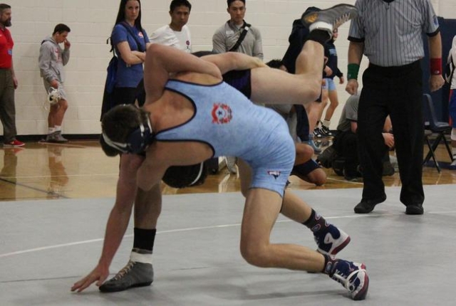 Centennial 132-pounder Centennial Nico Antuna takes down Durango‘s Kaden Renshaw durin ...