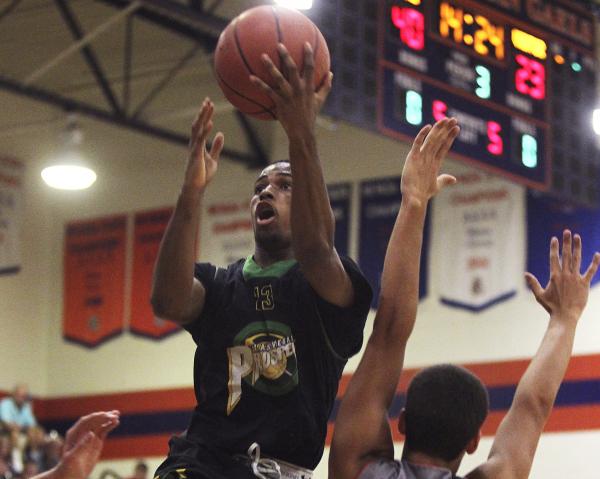 Las Vegas Prospects 17s guard Shaquile Carr drives to the basket Wednesday against the Wisco ...