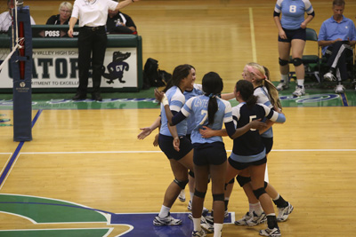 Centennial High School volleyball players celebrate after scoring against Palo Verde during ...