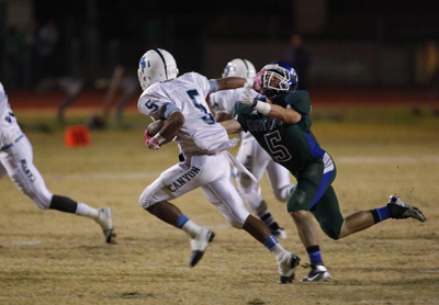 Canyon Spring High School’s Donnel Pumphrey (5) sprints as Green Valley’s Micah ...