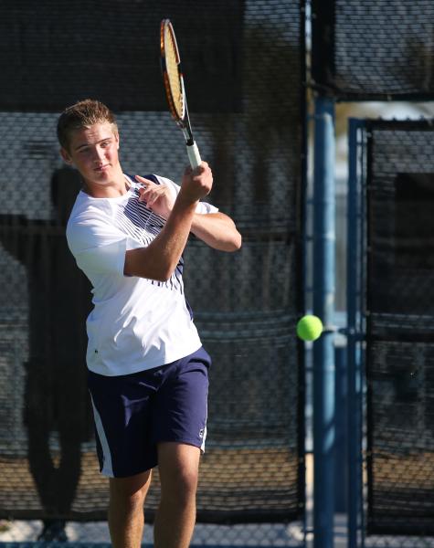 Coronado sophomore Ryland McDermott returns a ball during a Division I state championship ma ...