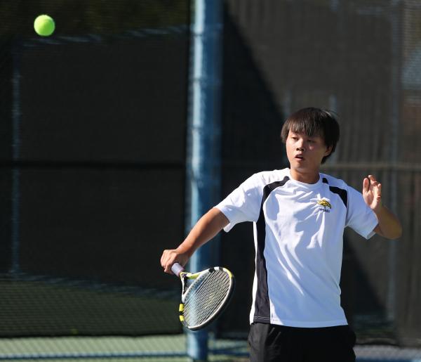 Clark senior Deric Pang returns the ball during a Division I-A state championship match agai ...