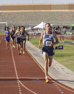 Centennial Bulldogs 1600 meter runner Nick Hartle already has a large lead over his competit ...