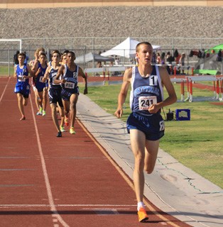 Centennial Bulldogs 1600 meter runner Nick Hartle already has a large lead over his competit ...
