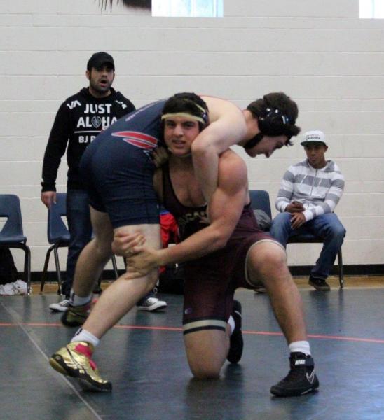 Faith Lutheran 220-pound sophomore Christian Khoury takes head-outside single leg, as Libert ...