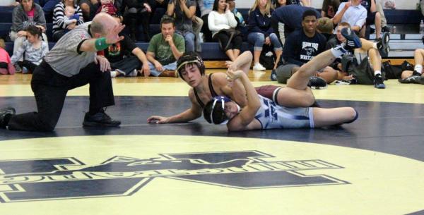 Faith Lutheran 113-pound freshman Joe LaPlaca exposes Shadow Ridge junior A.J. Bautista ...