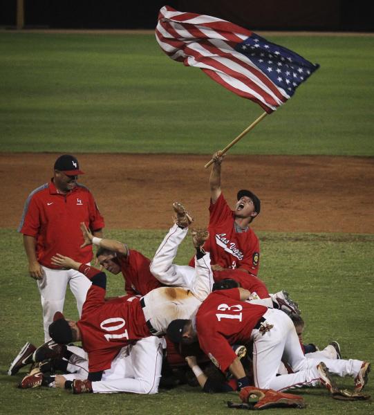 Liberty players celebrate their win over Cimarron-Memorial in the American Legion state cham ...