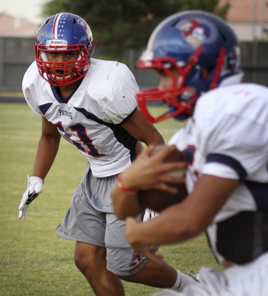 Liberty’s Samson Monterde pursues the ball carrier during practice.