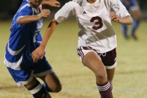Pahrump Valley High School soccer player Lexi Smith drives the ball down the field during a ...