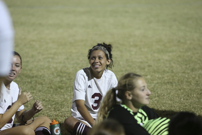 Pahrump Valley High School soccer player Lexi Smith is seen during the halftime talk during ...
