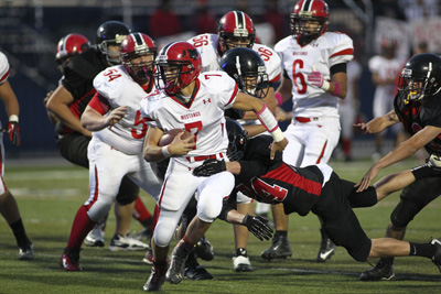Pershing County’s Seth Montes (7) pushes past a tackle from Mountain View’s Adam ...