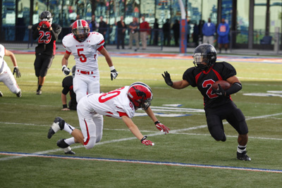 Mountain View football player Jacob Duldulao (2) runs past Pershing County’s defense a ...