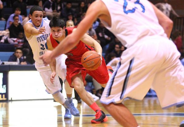 Las Vegas’ Roberto Zavala (5) gets past Foothill’s Austin Starr (30) as Ian Elli ...