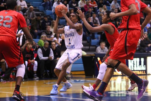 Foothill’s Jalen Shepard (1) looks to shoot as Las Vegas’ Devon Colley (12) reac ...