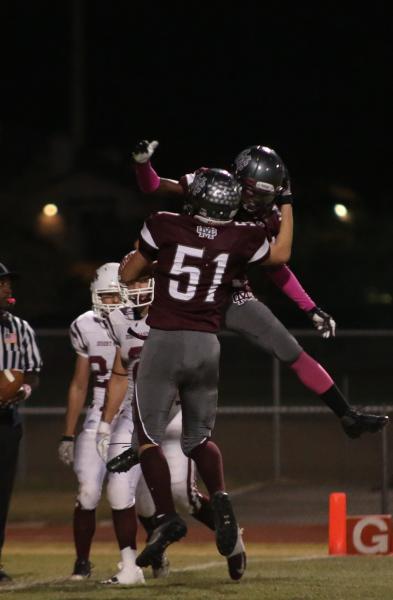 Cimarron-Memorial gaurd Gavin Dean (51) celebrates a first-quarter touchdown on Friday durin ...