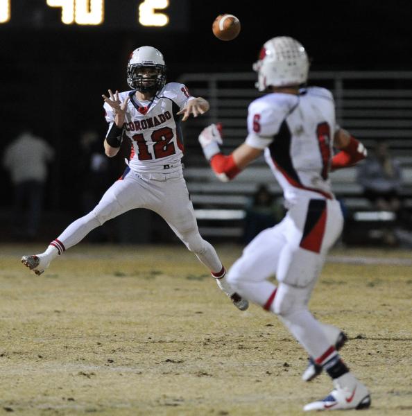 Coronado’s Jackson Cofer (12) throws a pass to Travis Boman (6) on Friday night. Cofer ...