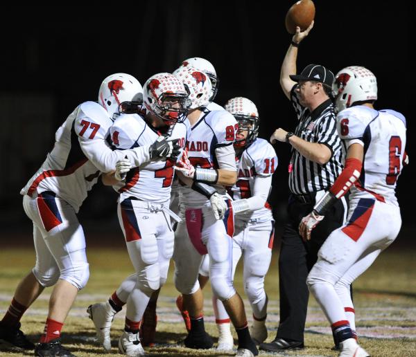 Coronado’s Michael Simpson (4) celebrates with teammates after scoring a touchdown aga ...