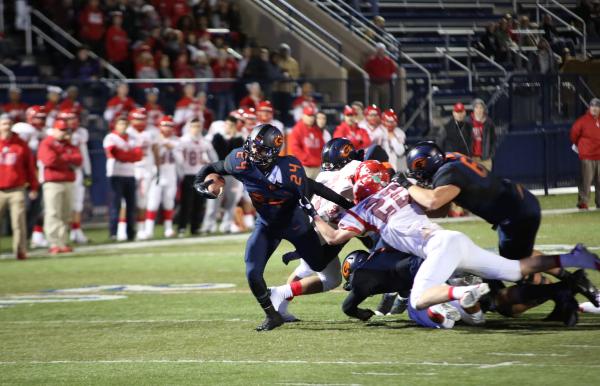 Bishop Gorman running back Russell Booze fights for extra yardage on Friday night. Booze had ...