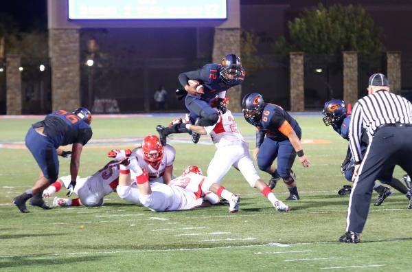 Bishop Gorman quarterbacK Randall Cunningham (12) carries the ball during the second quarter ...