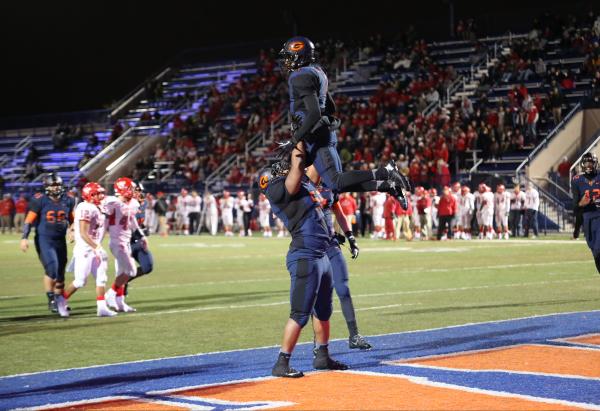 Bishop Gorman running back Daniel Stewart (1) is given a congratulatory lift after scoring a ...