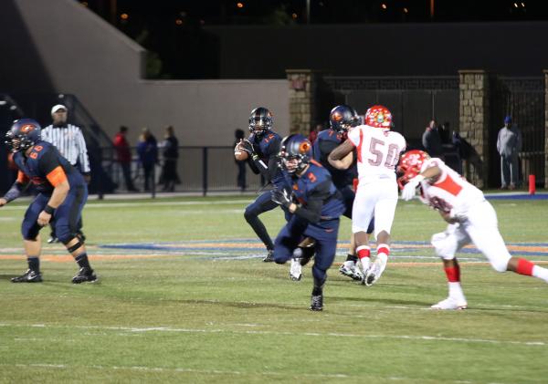 Bishop Gorman quarterback Randall Cunningham looks for a receiver on Friday night. Cunningha ...