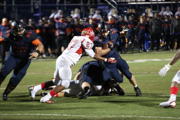 Bishop Gorman running back Jonathan Shumaker (33) carries the ball during the third quarter ...