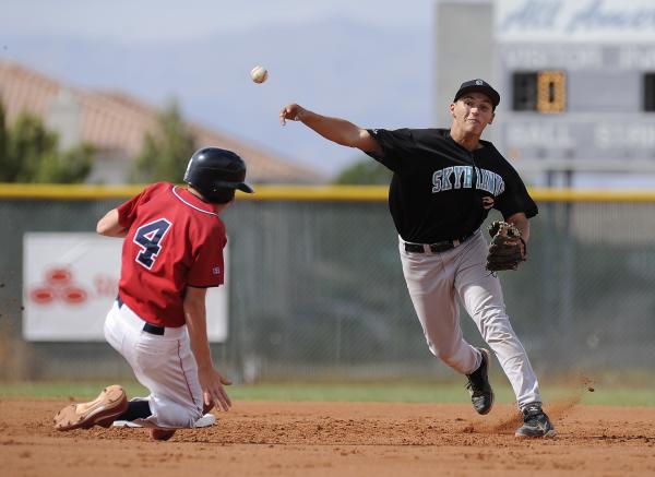 Silverado shortstop Dillon Johnson makes a relay to first to complete a double play as Liber ...