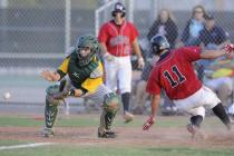 Liberty center fielder Preston Pavlica scores as Rancho catcher Zach Barnhart awaits the thr ...